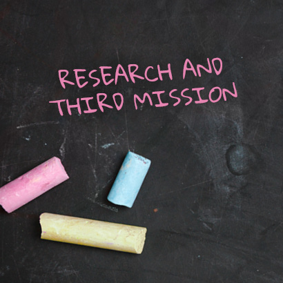 Research and third mission written on a backboard and 3 coloures chalckes